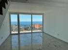 Dobra Vodada deniz manzaralı ve otoparklı modern deniz kenarı 65 m2 daire